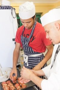 Young person learning to cook