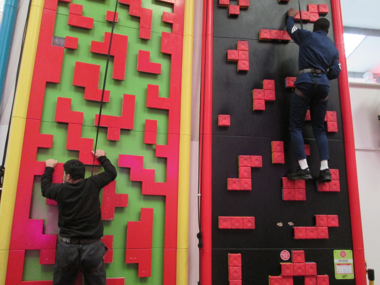 Students work together to climb obstacles!