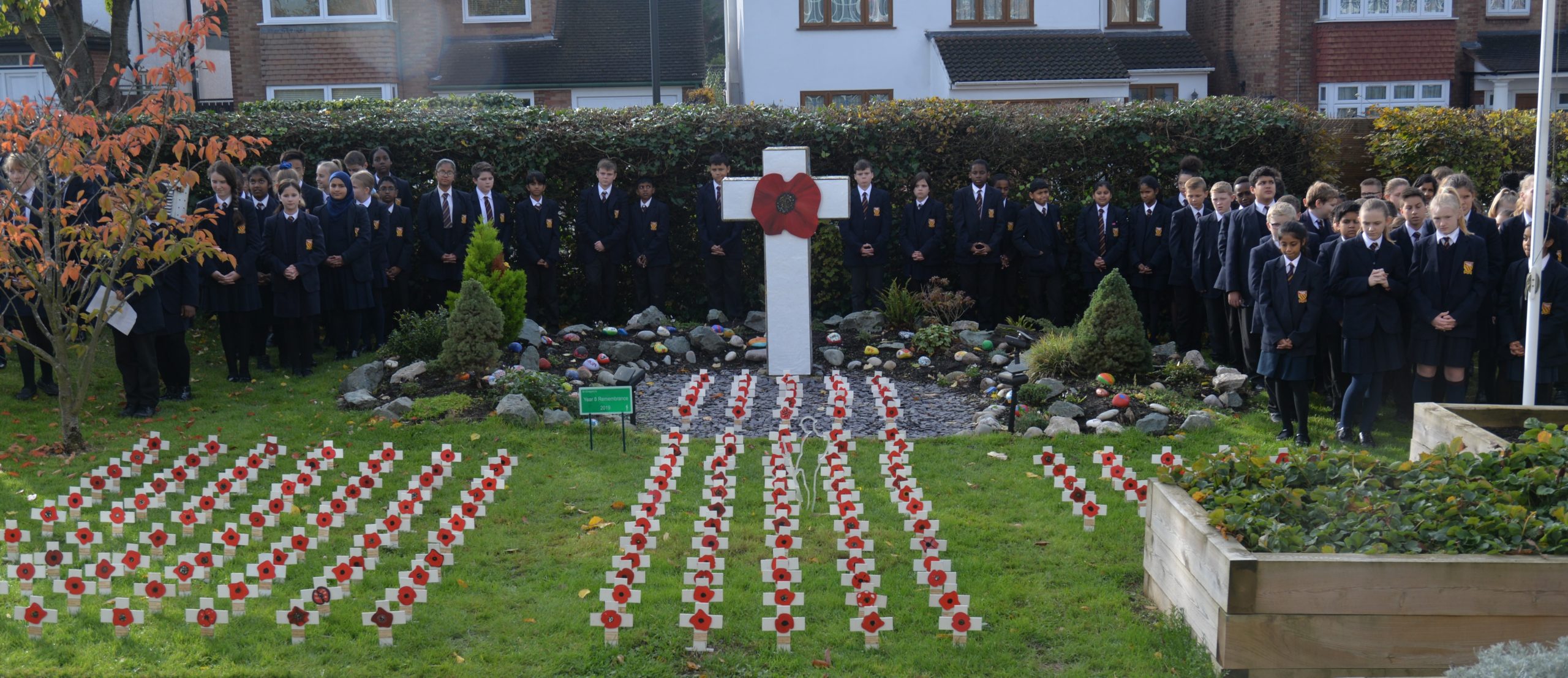 St. Gregory’s Catholic Science College mirror Tower of London poppy display for Remembrance Day