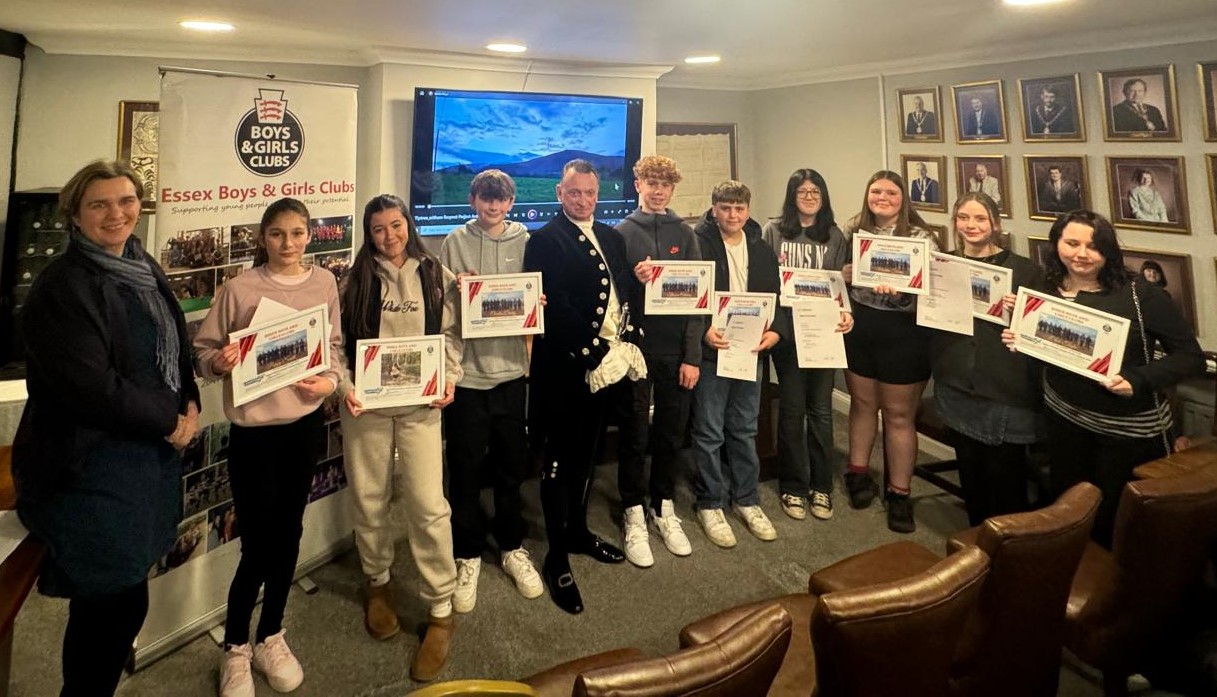 A group of young people holding certificates