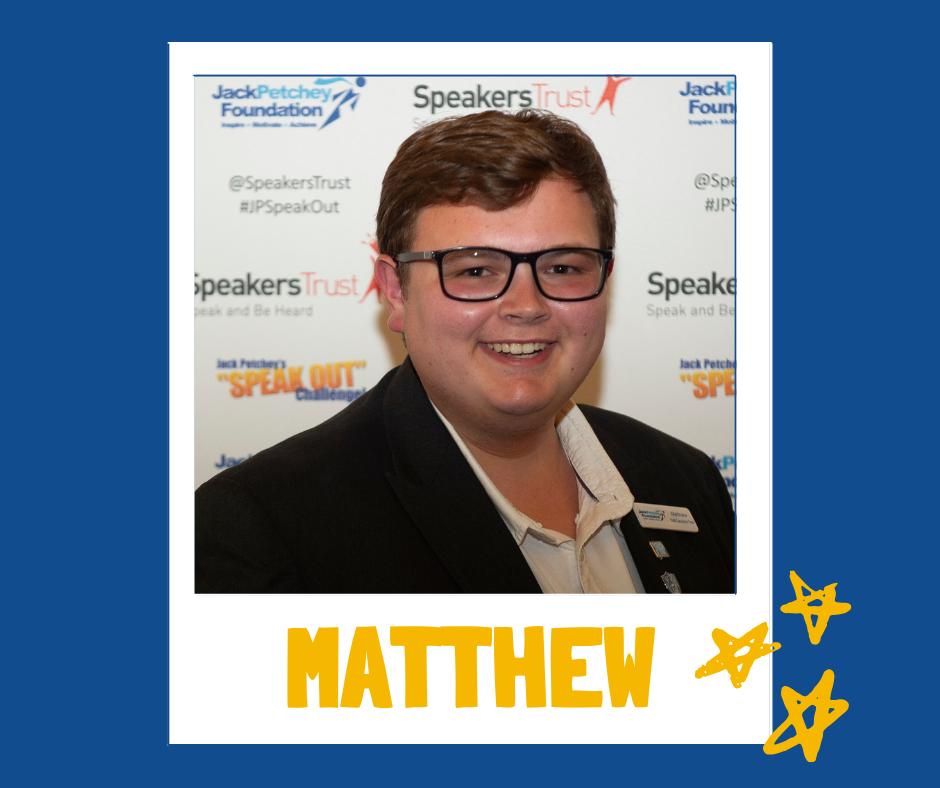 A portrait-style image of a person wearing a black blazer and a light-colored collared shirt. They are standing in front of a branded backdrop featuring the Jack Petchey Foundation and Speakers Trust logos, along with phrases such as “Speak Out” and “Be Heard.” The photo is framed like a polaroid with a blue border, yellow star doodles in the bottom right corner, and the name “MATTHEW” written in bold yellow letters at the bottom.